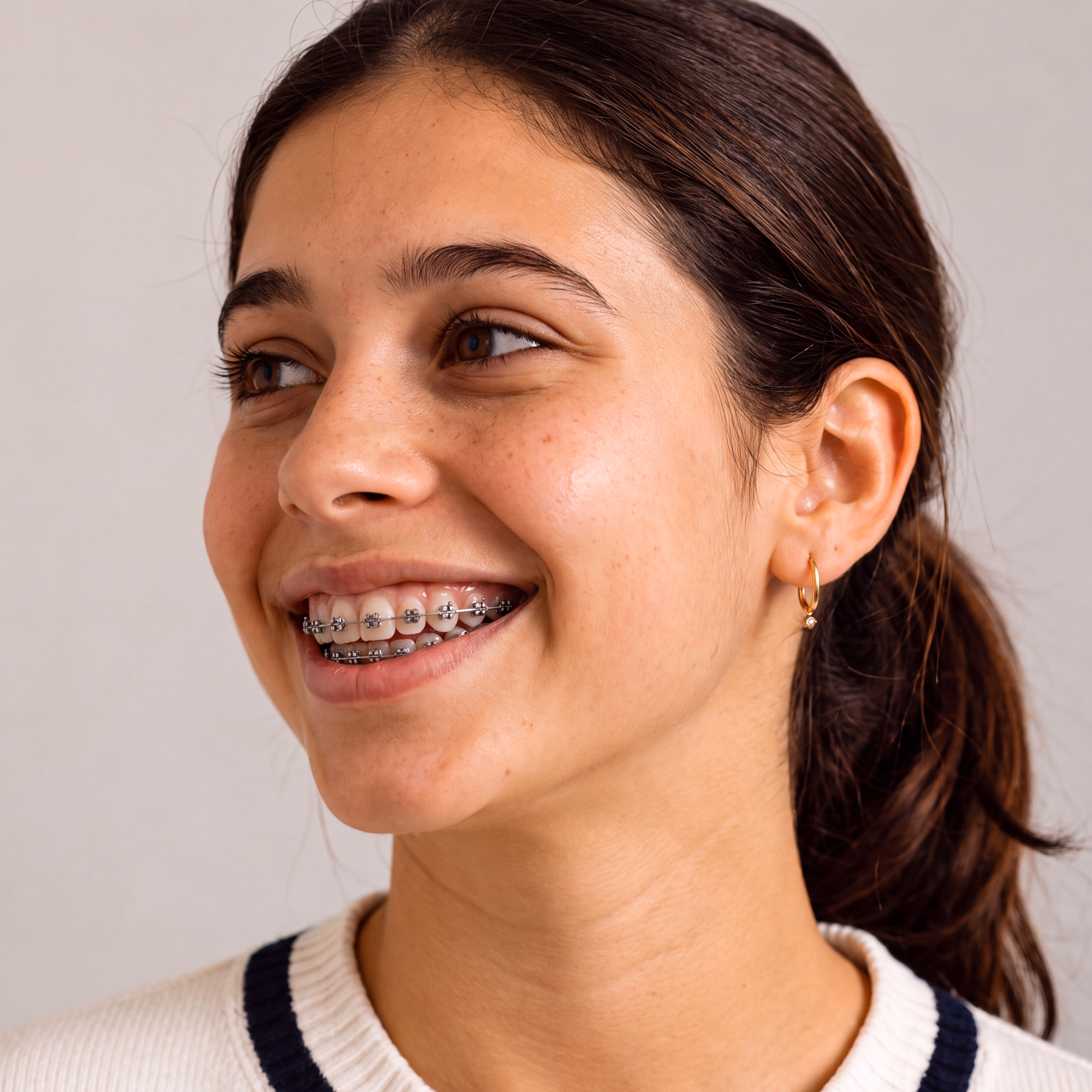 A patient wearing metal braces